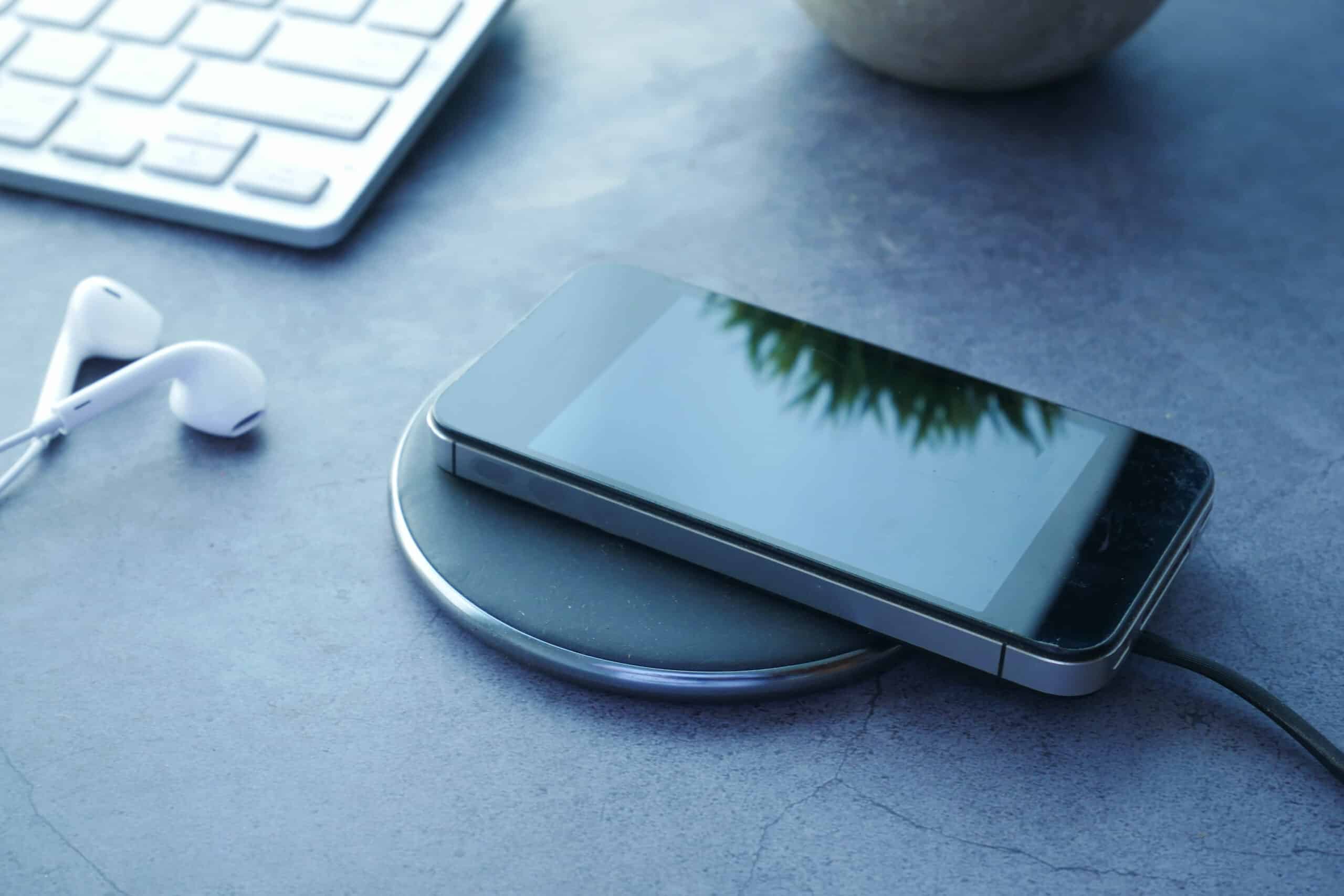 a phone on top of a wireless charging pad